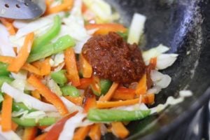 red chilli sauce added to vegetables