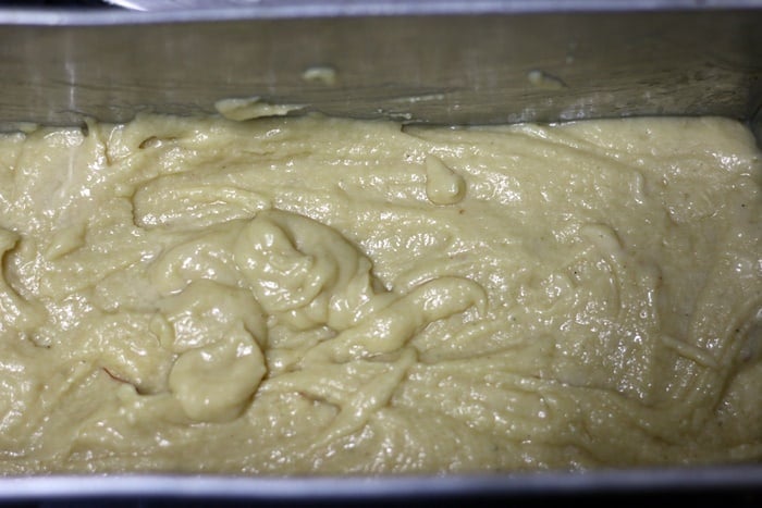 Gulab jamun cake batter in a greased loaf tin
