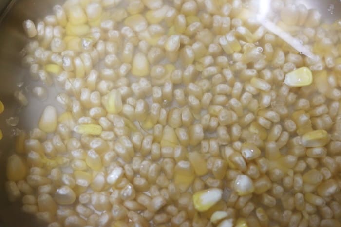 fresh corn kernels in a pressure cooker